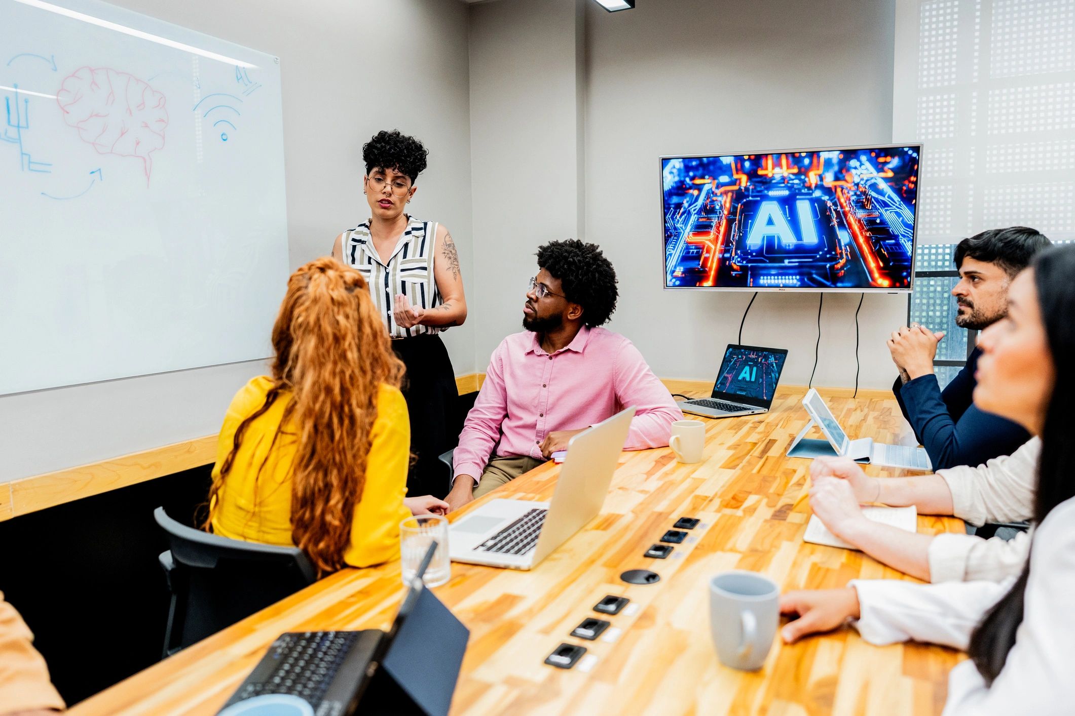 Presenter leading an AI training session with a team